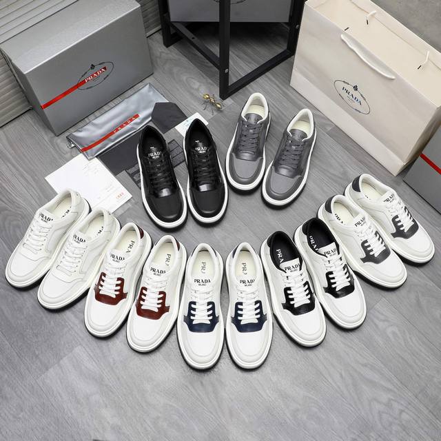 商品商标：Prada 普拉达 休闲板鞋 正码码数: 38-44 45订做不退换 商品材料：精选 头层牛皮拼接鞋面 透气网内里 牛皮鞋垫 原版大底