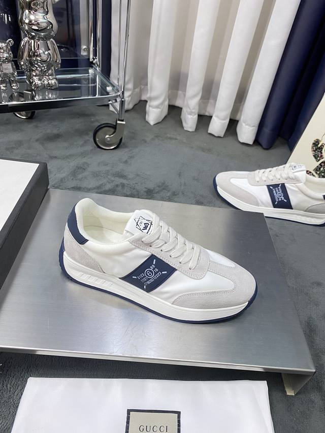 商品商标:GUCCI 古奇 休闲鞋 正码码数:38-44 商品材料:鞋面头层牛皮拼接布料，进口网布内里猪皮垫脚，原版防滑橡胶大底，整体造型浑然天成，重新设计打造